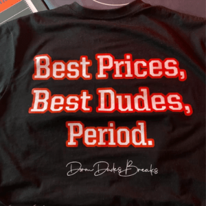 Back view of black Dorm Dudes Breaks shirt with slogan 'Best Prices, Best Dudes, Period.